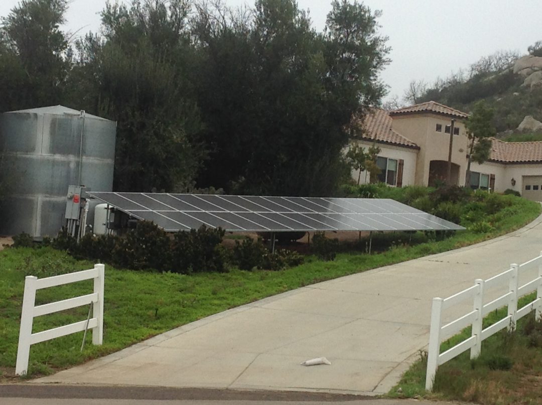 A solar panel sitting on top of the ground.